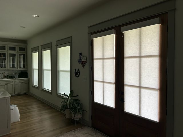 Custom cellular shades in a Des Moines living room chosen for energy savings