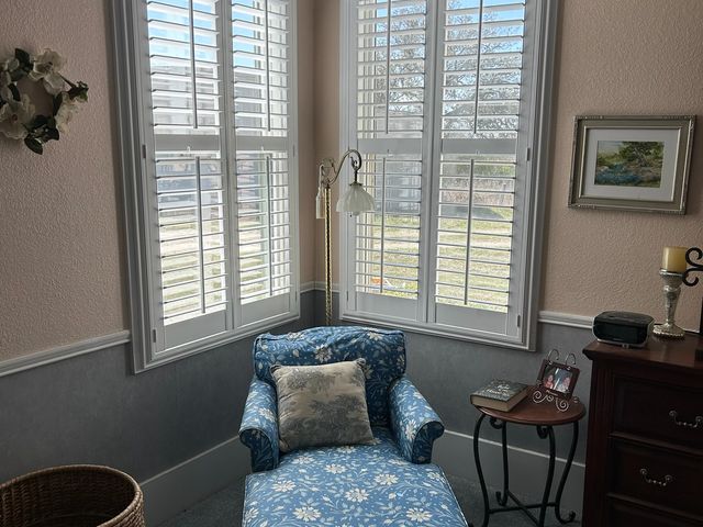 Custom fit plantation shutters installed on an out of square historic window frame