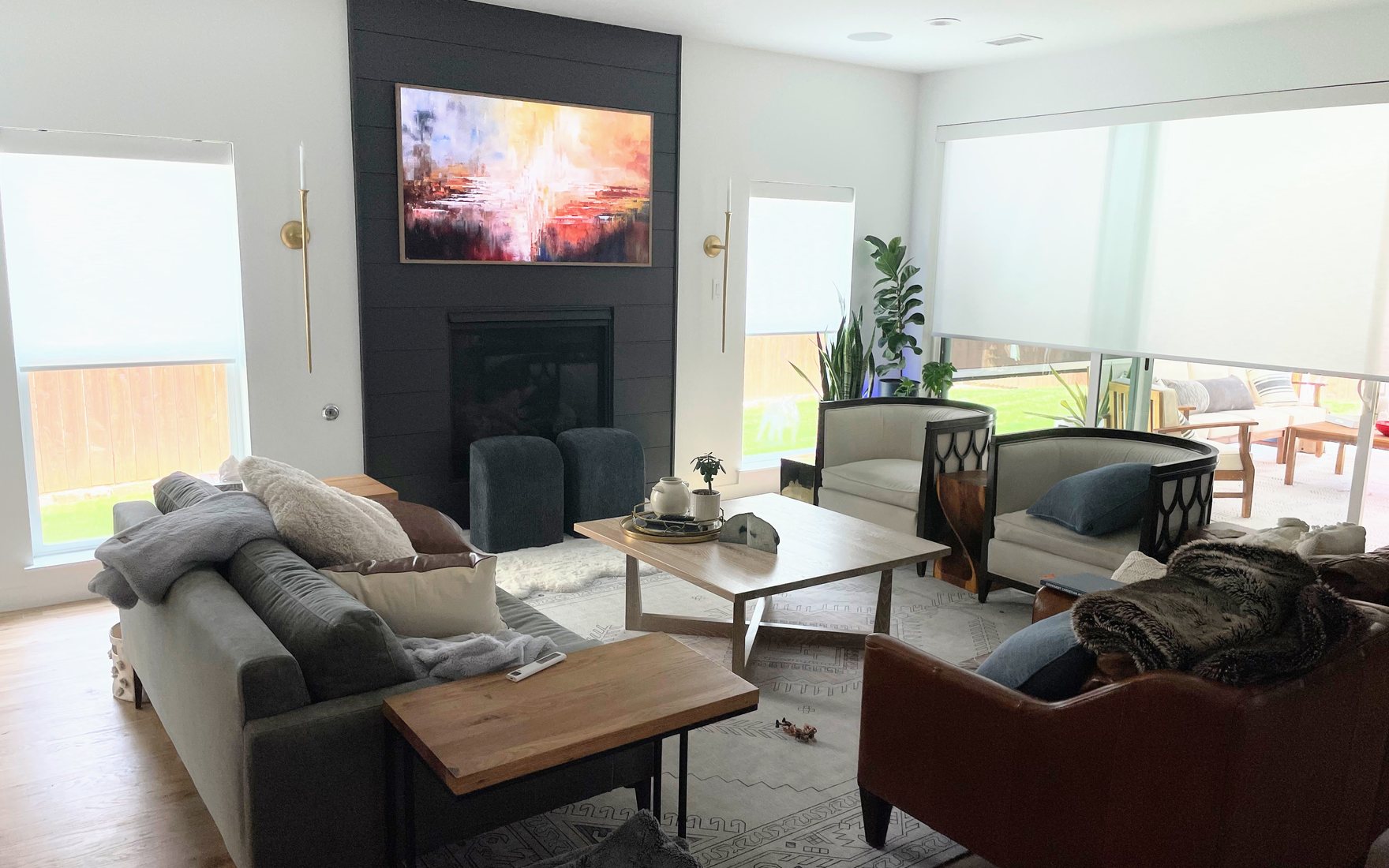 Custom roller shades across a bay window in a new construction Grimes home