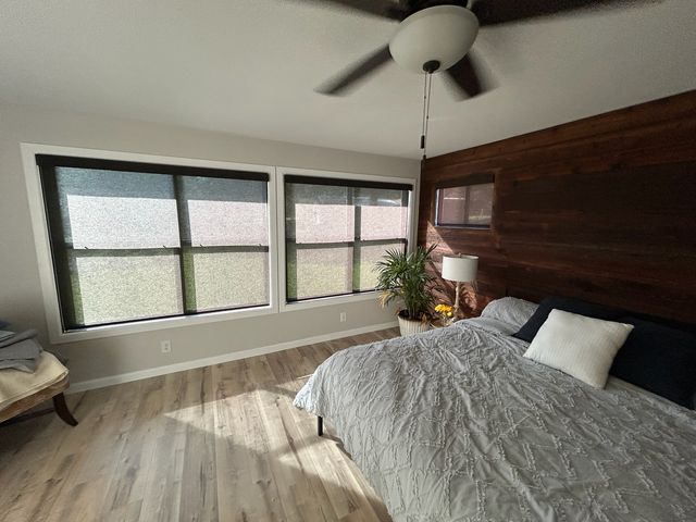Motorized shades on a tall great room window in a new Waukee construction home