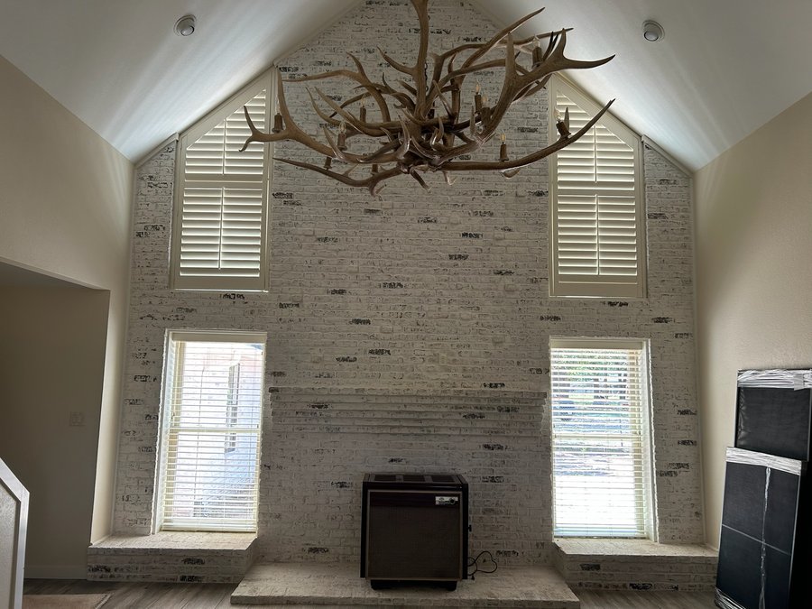 Real wood blinds in a split level Des Moines living room window