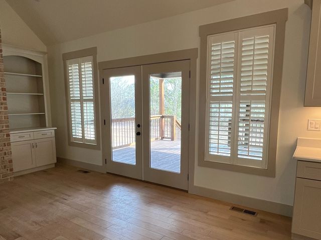Custom shutters fitted to a Tudor Revival bungalow window in Beaverdale