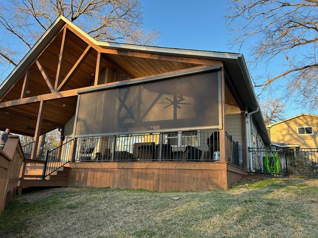 Solar shade mesh fabric preserving the backyard view from a shaded Iowa patio