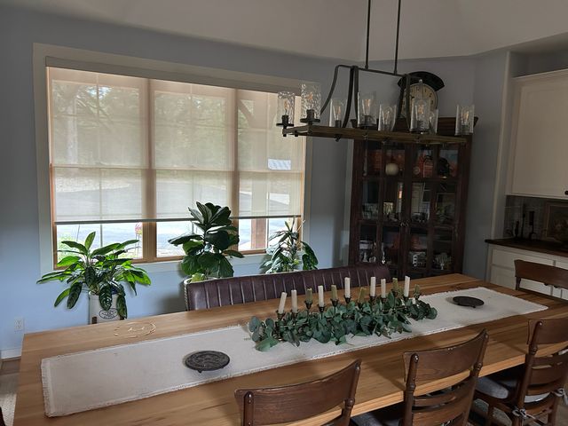 Solar shades on floor to ceiling glass in a downtown Des Moines condo