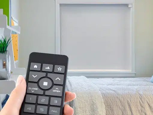 Motorized roller shade operated by a handheld remote