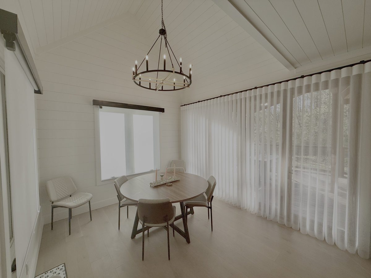 Floor-to-ceiling smart sheer drapery in a bright dining room by Love Is Blinds