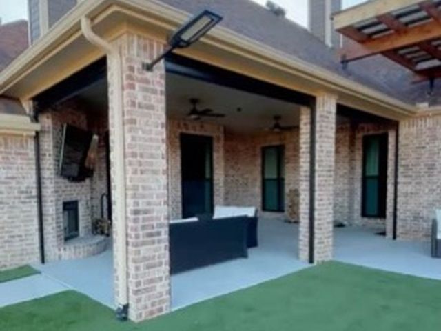 Custom patio shades installation by Love Is Blinds Iowa