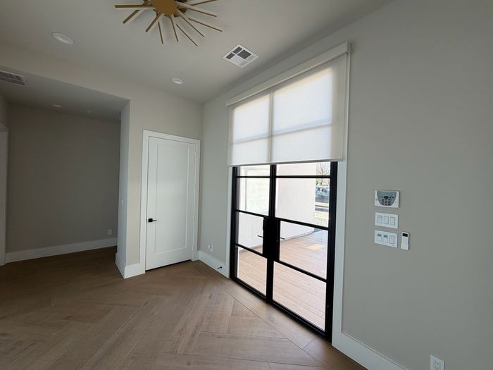 Custom Roller Shades installation by Love Is Blinds Iowa
