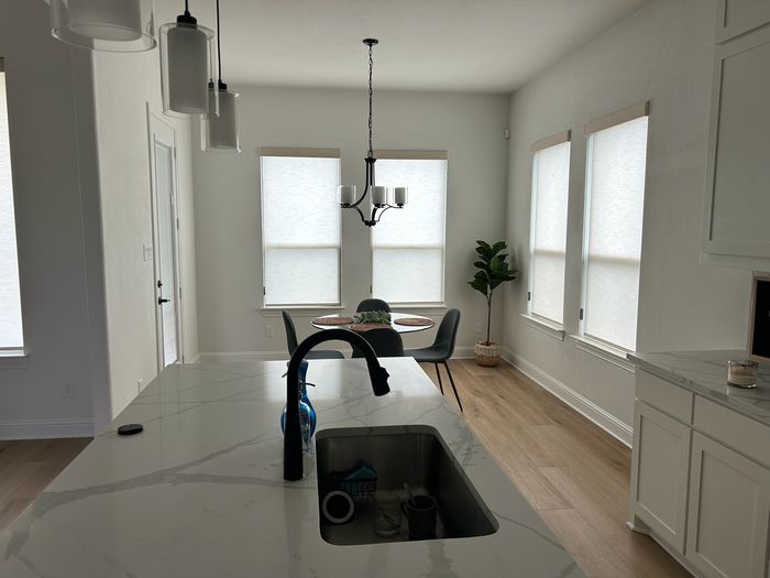Custom Roller Shades installation by Love Is Blinds Iowa