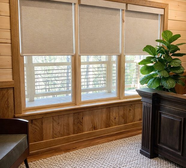 Custom roller shades in an Iowa living room by Love Is Blinds