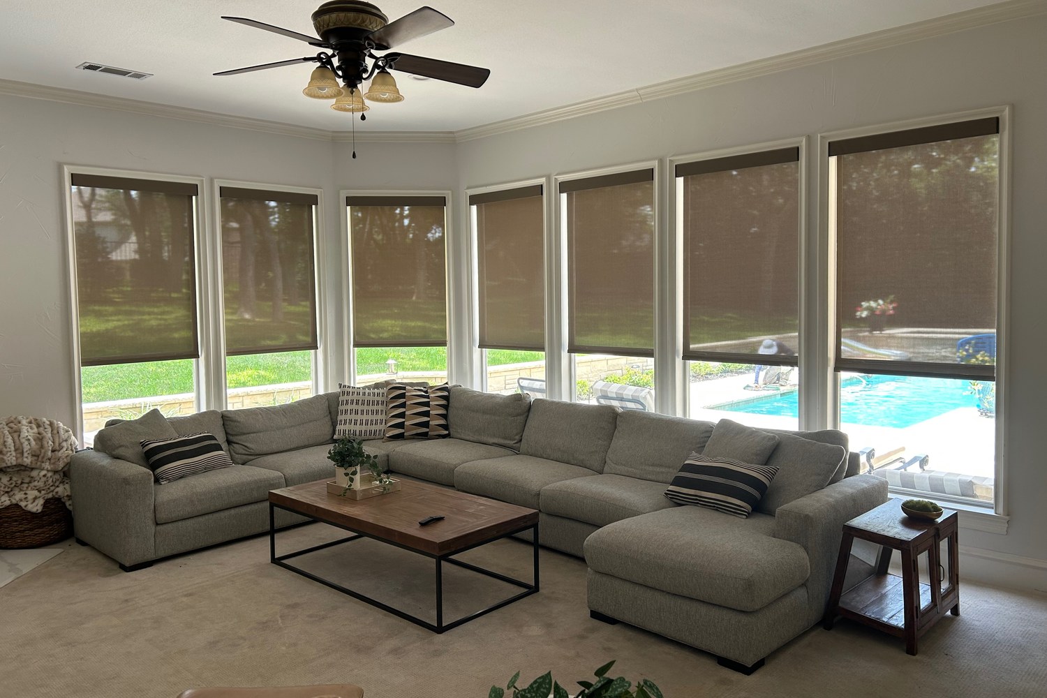 The same windows fitted with custom roller shades by Love Is Blinds
