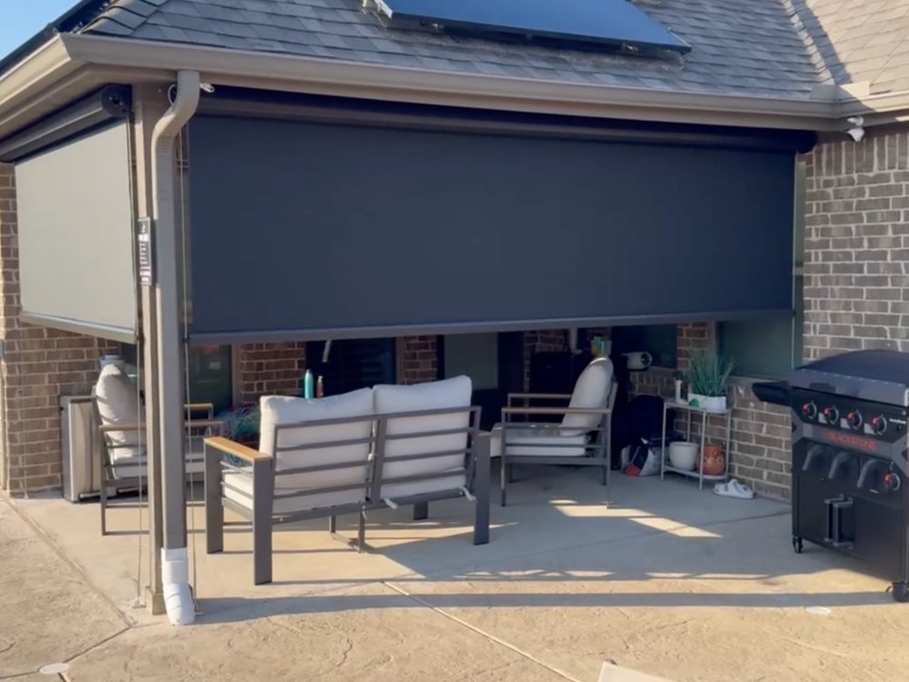 Exterior patio shade held steady by steel cables on a large opening by Love Is Blinds