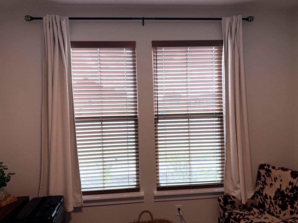 Real wood blinds with warm hardwood grain in an Iowa home by Love Is Blinds