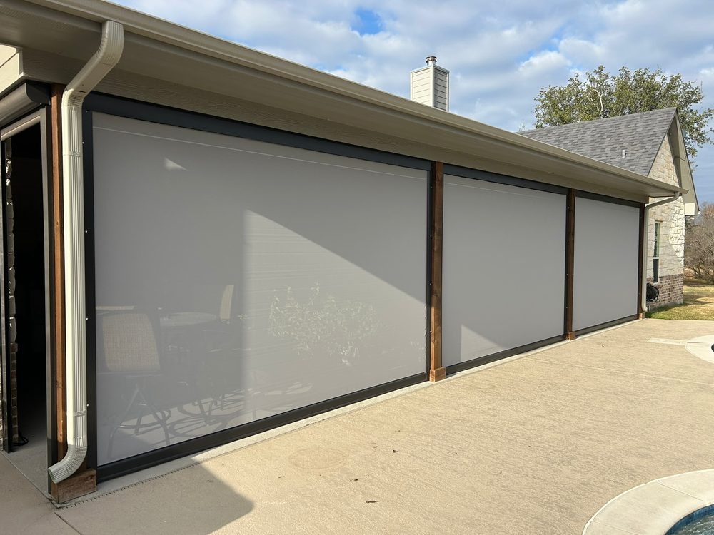 Exterior patio shade running in side channels for a sealed edge by Love Is Blinds
